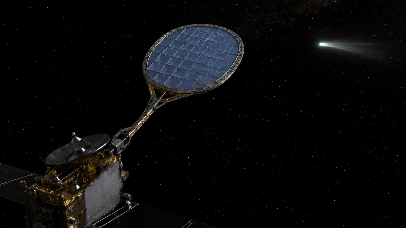 A spacecraft holding out an aerogel-filled collector grid to catch comet dust near a faint comet in deep space