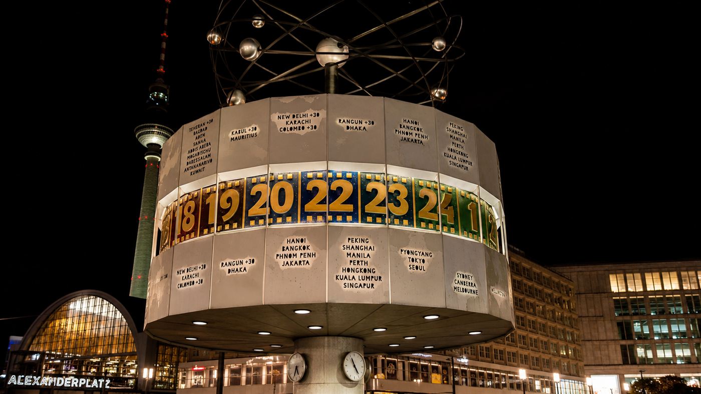 The Berlin World Clock lit up at night, a clue word hidden inside the Kryptos K4 passage
