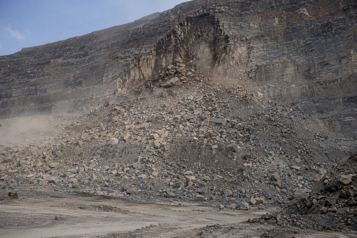 A massive landslide of rock and debris spread across the floor and wall of the Bingham Canyon pit after the 2013 collapse