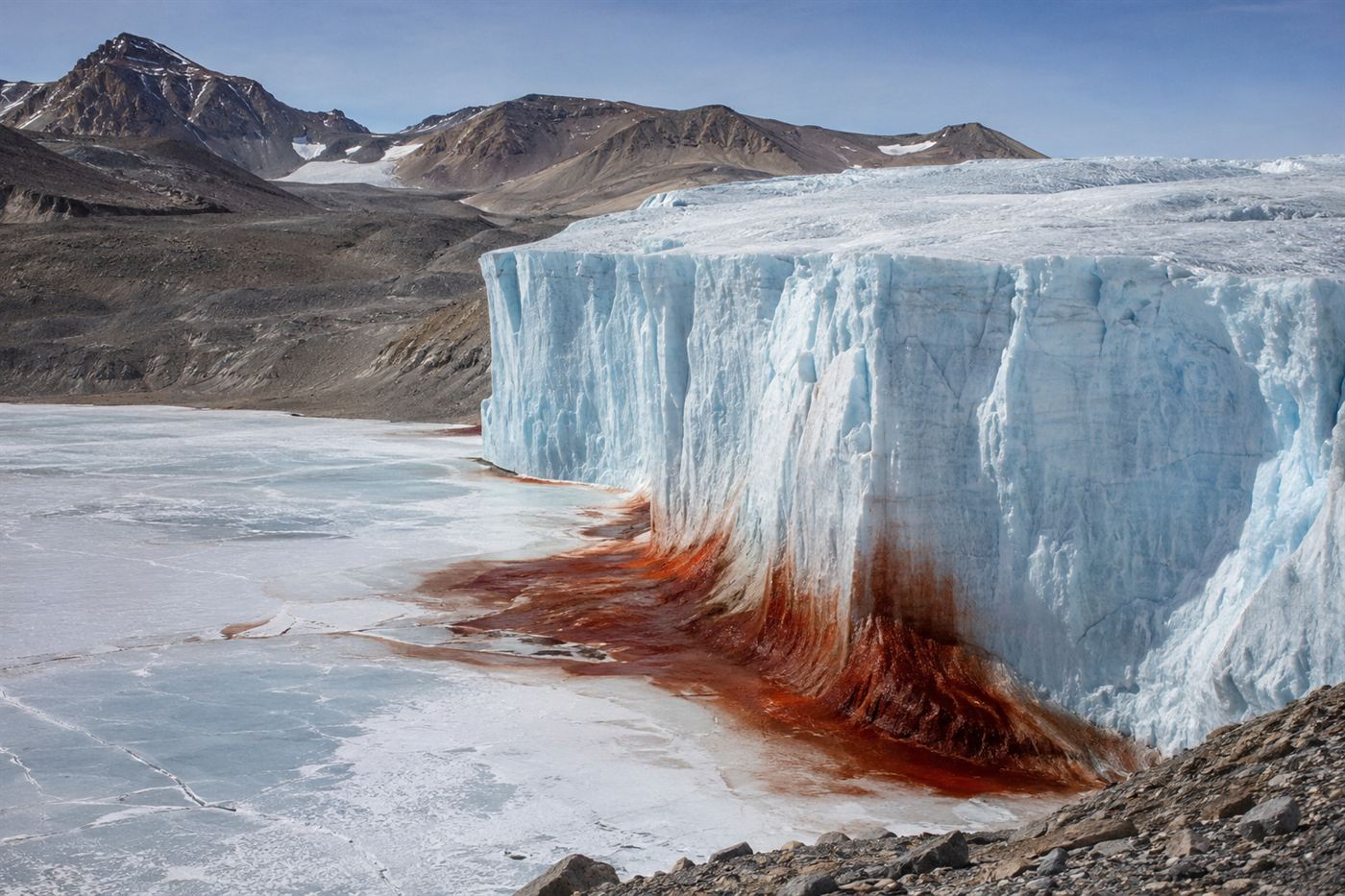 The Taylor Glacier meeting a frozen lake in the McMurdo Dry Valleys of Antarctica with a red iron stain at its base