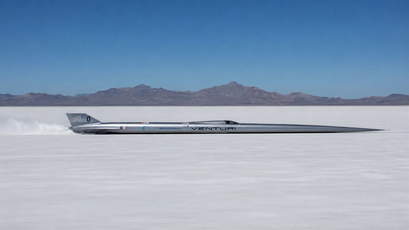 The long needle-shaped Buckeye Bullet electric streamliner racing across the white Bonneville Salt Flats