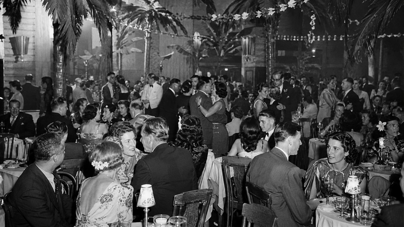 A crowded 1940s Boston nightclub with flammable palm-tree decor like the Cocoanut Grove