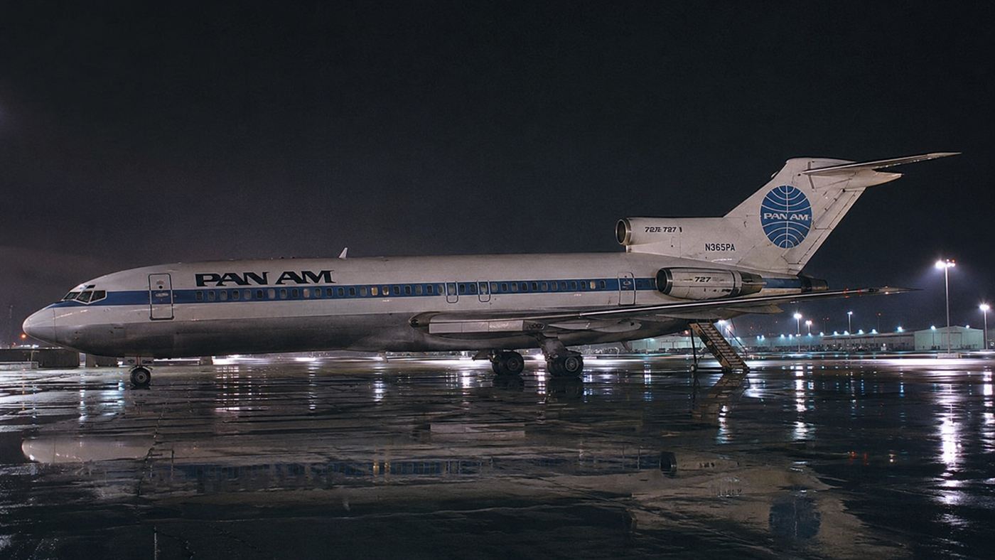 A 1971 Boeing 727 on a rainy night tarmac with its rear airstair lowered, evoking the D.B. Cooper hijacking