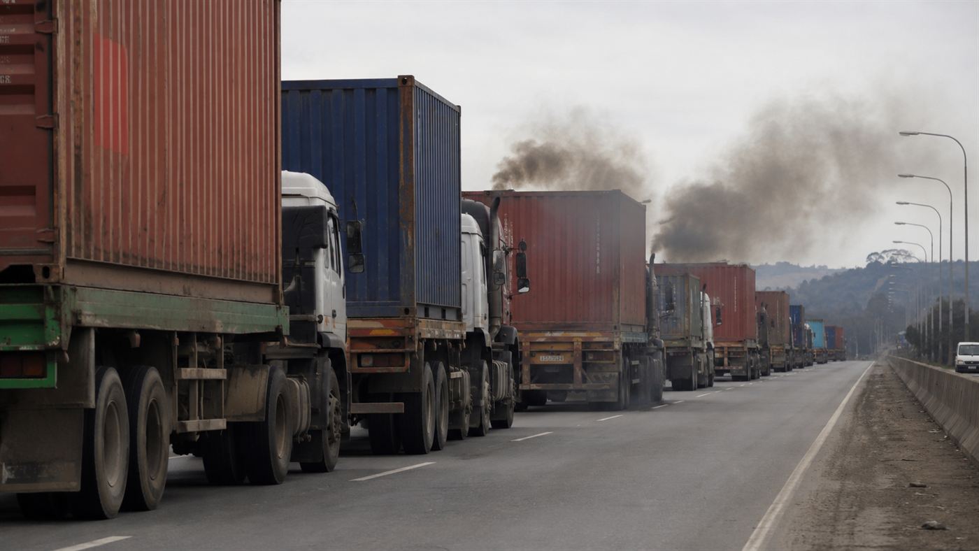 A long line of diesel container trucks on a highway, the kind of journeys the Yara Birkeland replaces