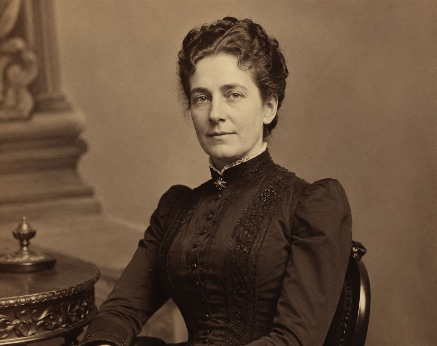 An 1880s portrait of Emily Warren Roebling, a Victorian woman in a dark high-collared dress