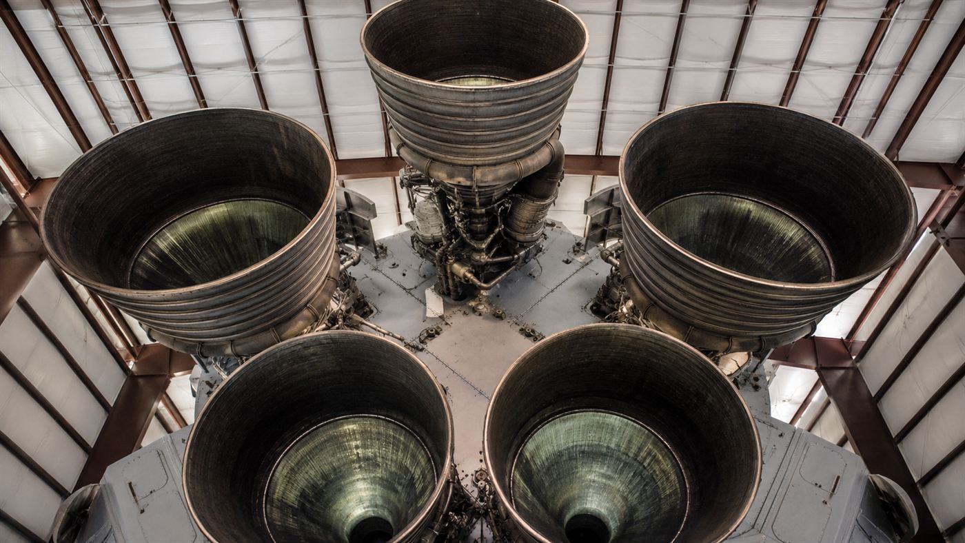 The cluster of five enormous bell-shaped F-1 rocket engine nozzles at the base of a rocket