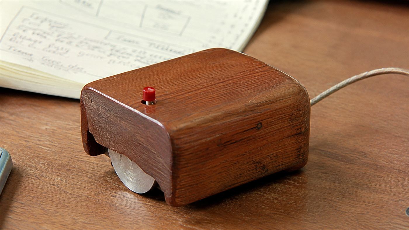 The original 1960s wooden computer mouse prototype with a single button and a cord