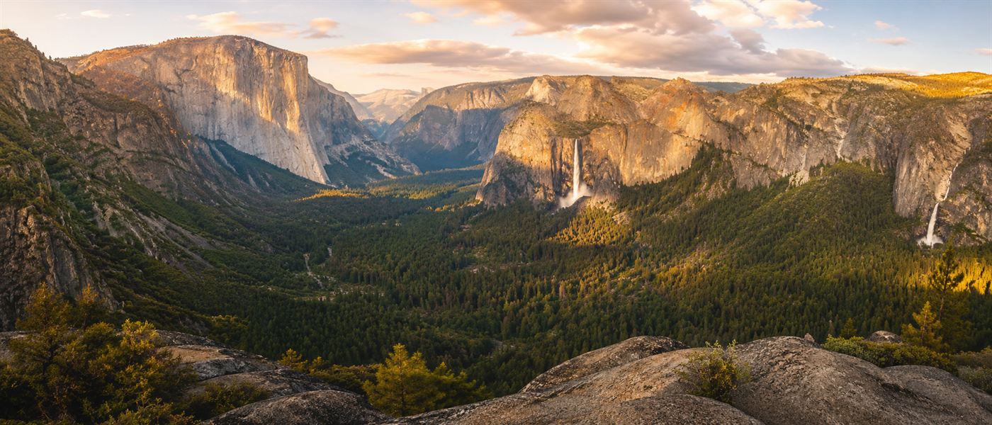 The view from Glacier Point over Yosemite Valley with granite cliffs and forest below, where the old ember firefall was pushed off the edge
