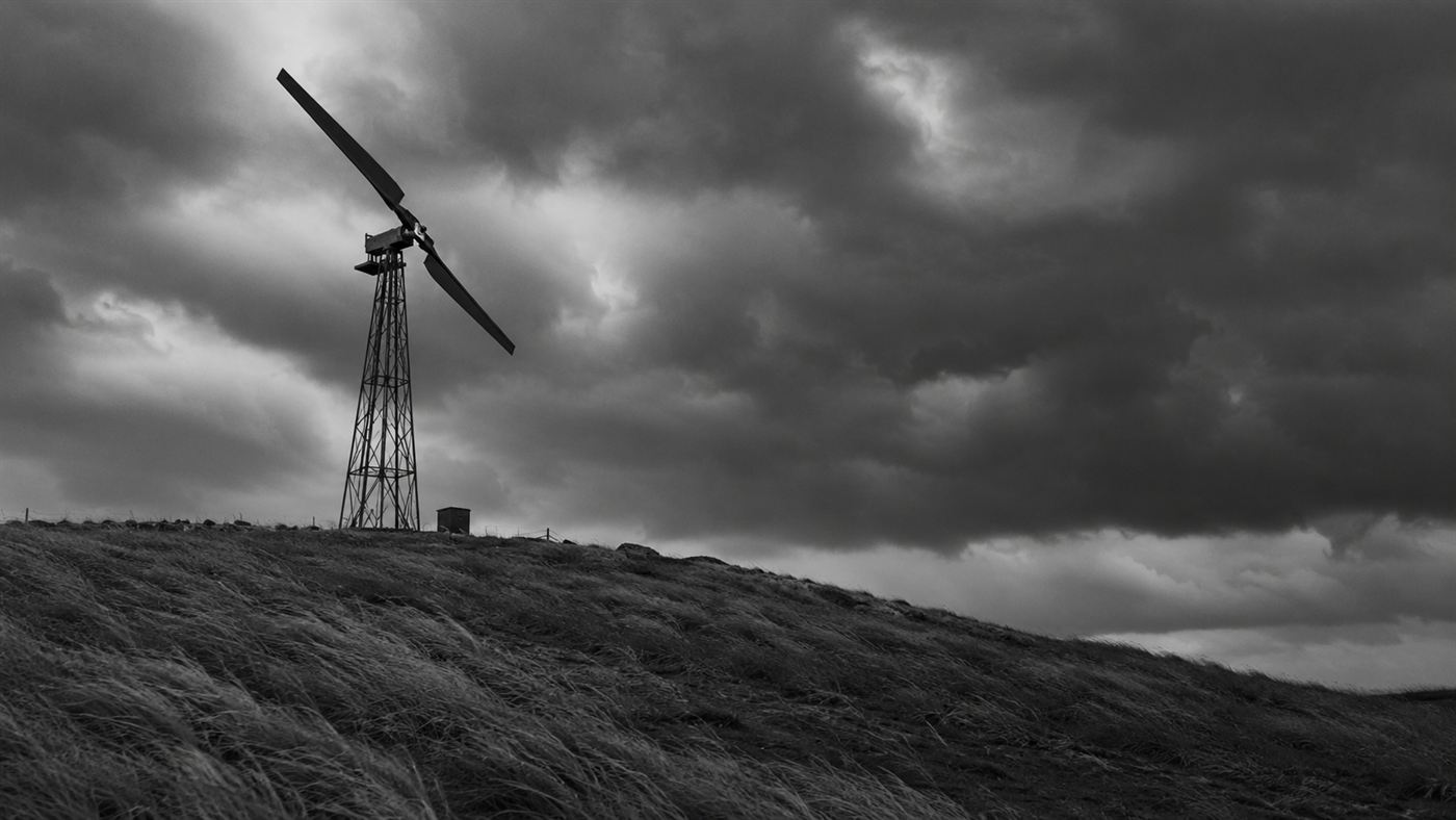 The Smith-Putnam wind turbine silhouetted against a stormy sky on Grandpa's Knob, Vermont