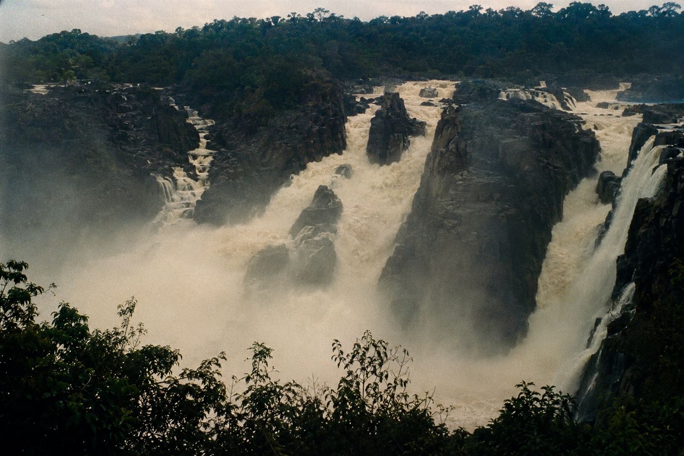 The cascading white water of Guaira Falls known as Sete Quedas on the Parana River in Brazil in the 1970s, powerful torrents of water rushing through a narrow volcanic rock gorge
