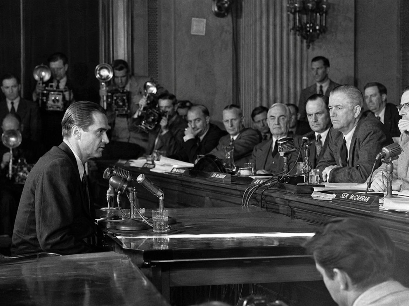 Howard Hughes testifying at the 1947 Senate War Investigating Committee hearing in Washington D.C., the aviator and industrialist facing senators who questioned whether the Spruce Goose flying boat had defrauded the US government