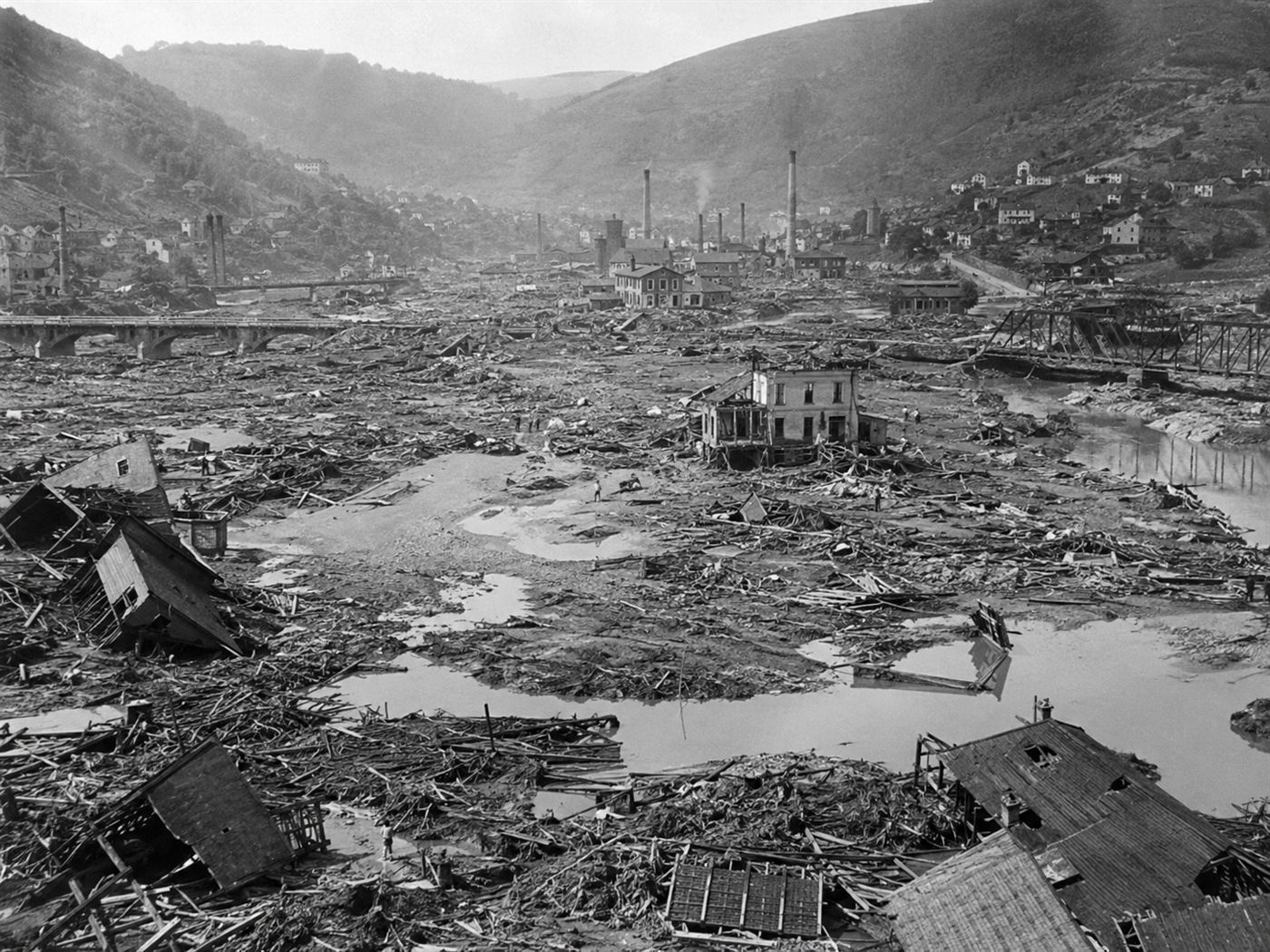 Aerial view of Johnstown Pennsylvania devastation after the 1889 flood, Conemaugh valley filled with debris and collapsed 19th century wooden buildings, wreckage of the dam failure