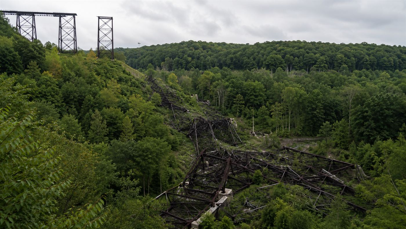 The twisted steel towers of the Kinzua Bridge lying in the gorge after the 2003 tornado
