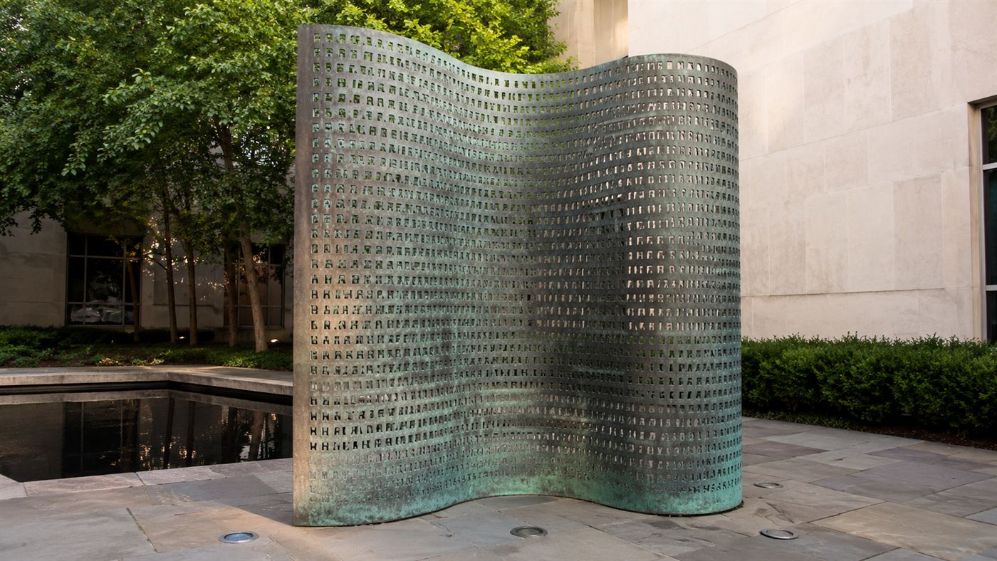 The Kryptos sculpture at CIA headquarters, a curved copper screen covered in encrypted letters