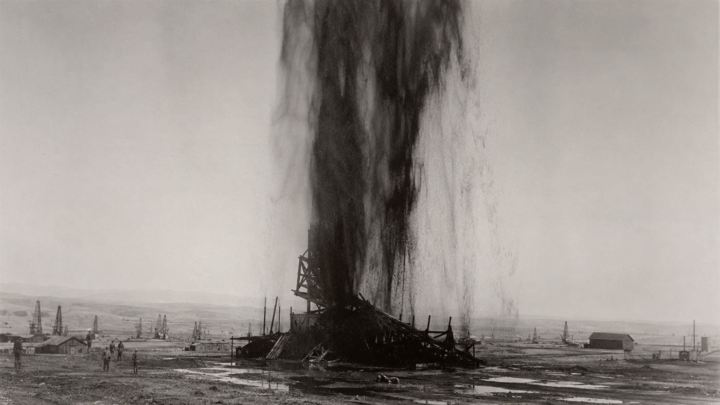 The Lakeview Gusher of 1910, a towering black fountain of oil erupting from a wrecked derrick in the California desert