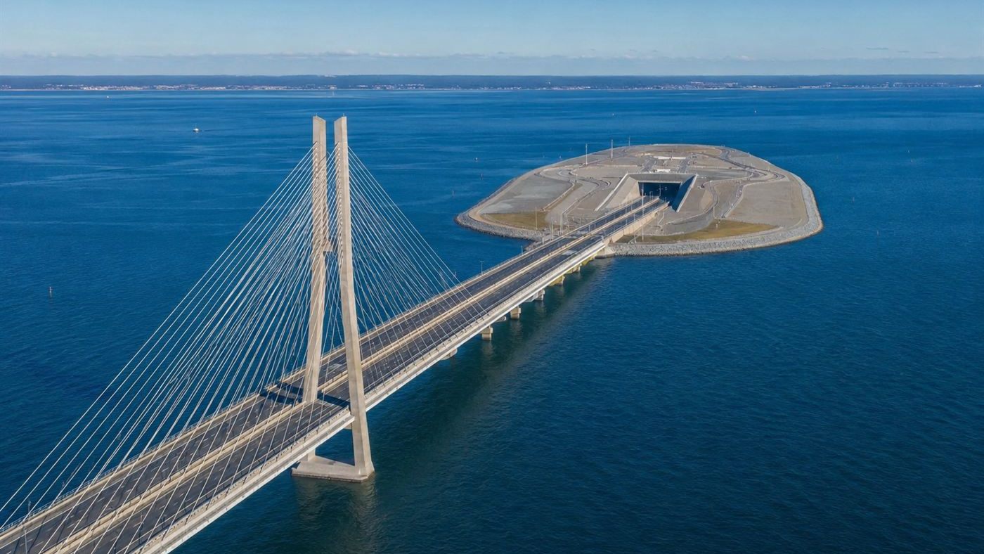 Aerial view of the Oresund Bridge crossing the sea toward an artificial island where it descends into a tunnel