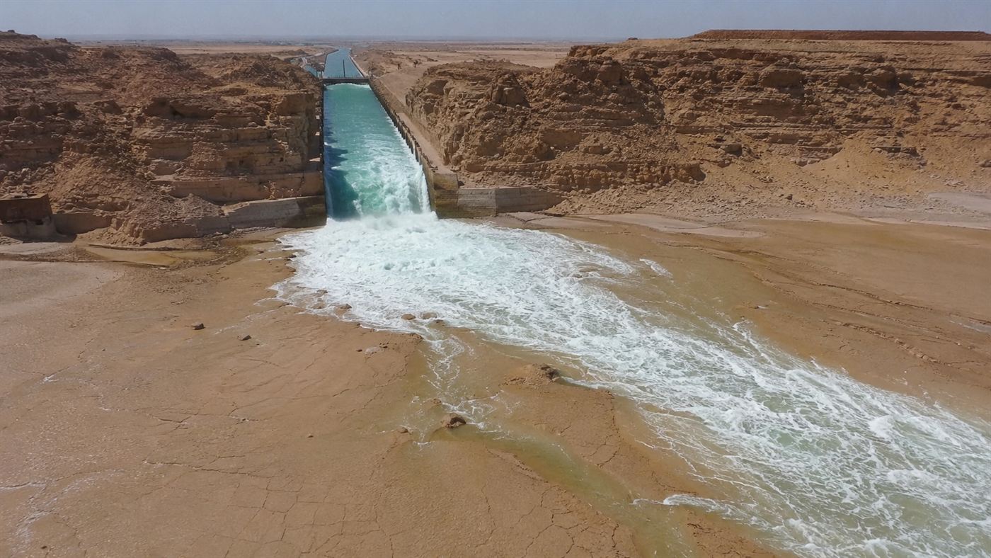 Seawater rushing down a canal into the desert basin in the Qattara Depression Project