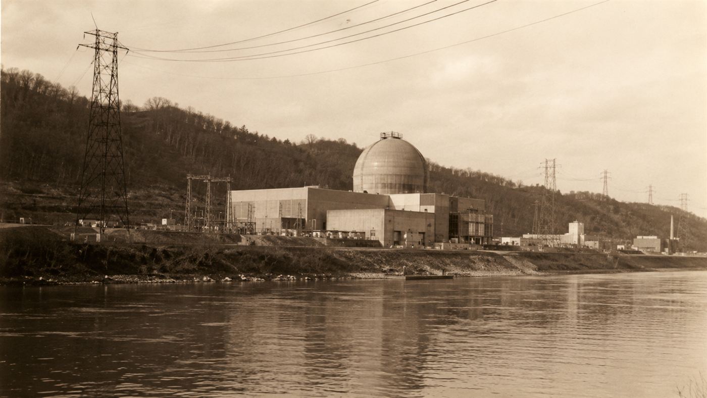 The Shippingport atomic power station on the bank of the Ohio River in Pennsylvania in the late 1950s, a domed reactor building beside the water