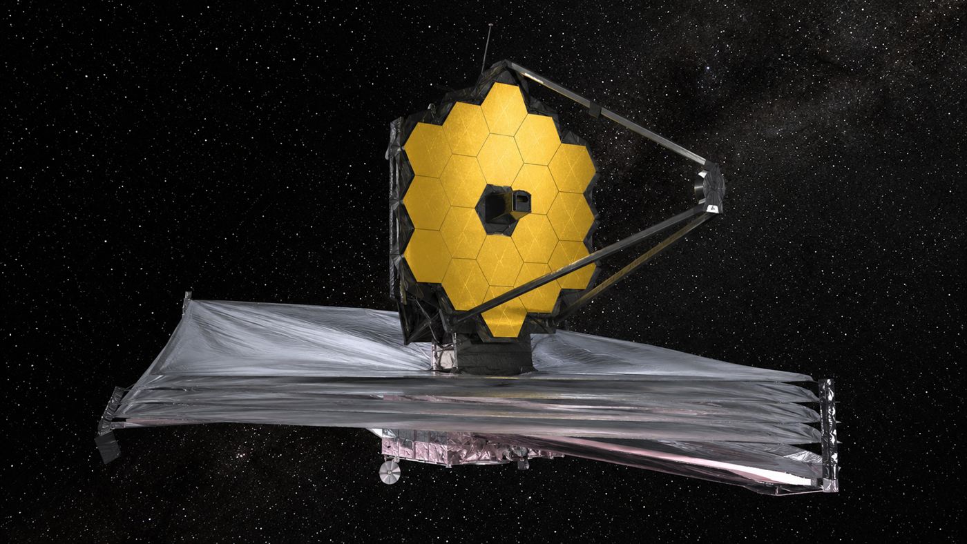 The James Webb Space Telescope deployed in deep space with its golden hexagonal mirror above the silver sunshield