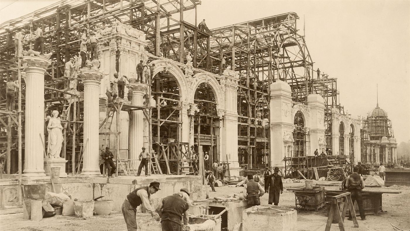 Workers in 1893 building a huge fair palace, moulding white plaster staff decorations over a bare wooden and steel framework