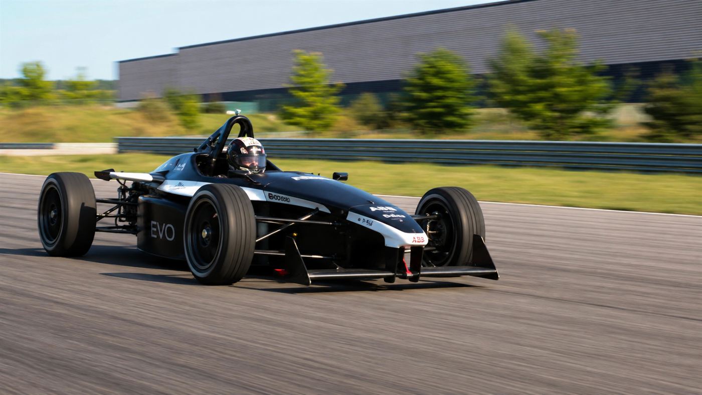The Wrightspeed X1, a sleek lightweight electric prototype sports car on a test track