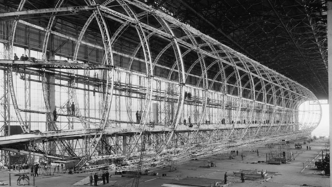 The enormous airship sheds at Cardington with a vast rigid airship framework under construction inside