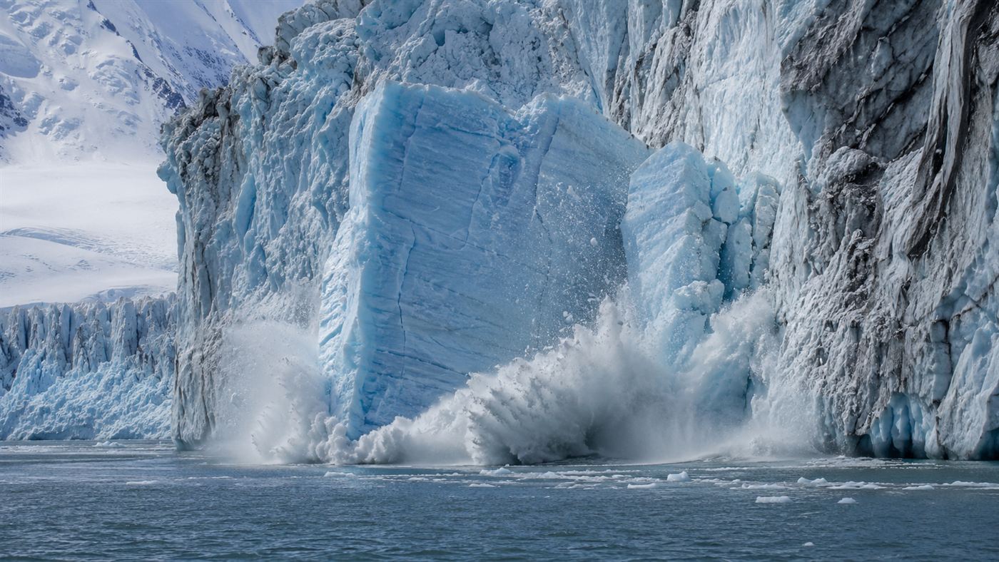A colossal iceberg cracking and calving off an Antarctic glacier into the sea, the real cause of the Bloop