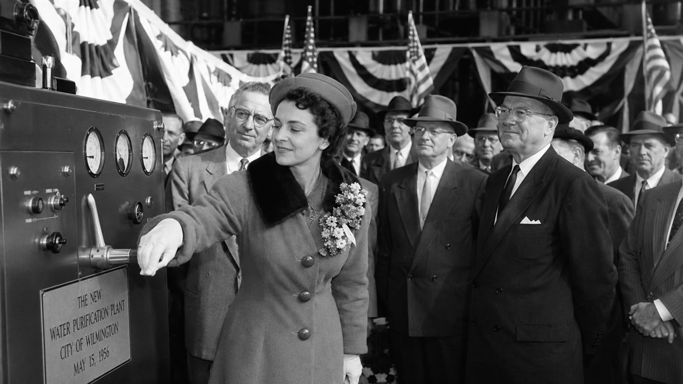 A 1956 ceremony opening Calder Hall, with a dignitary pulling a lever before a crowd