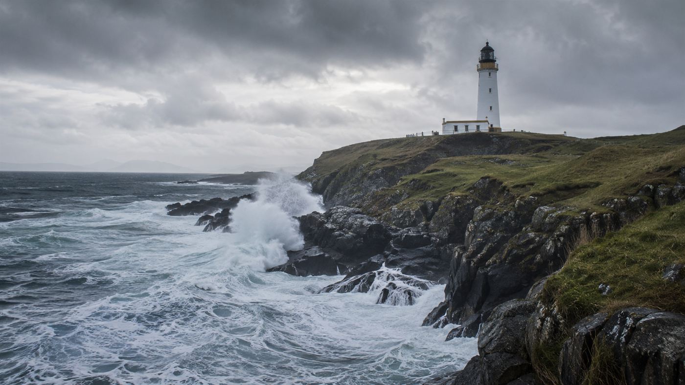 The Flannan Isles lighthouse on a remote Scottish island cliff battered by huge Atlantic waves under a stormy sky
