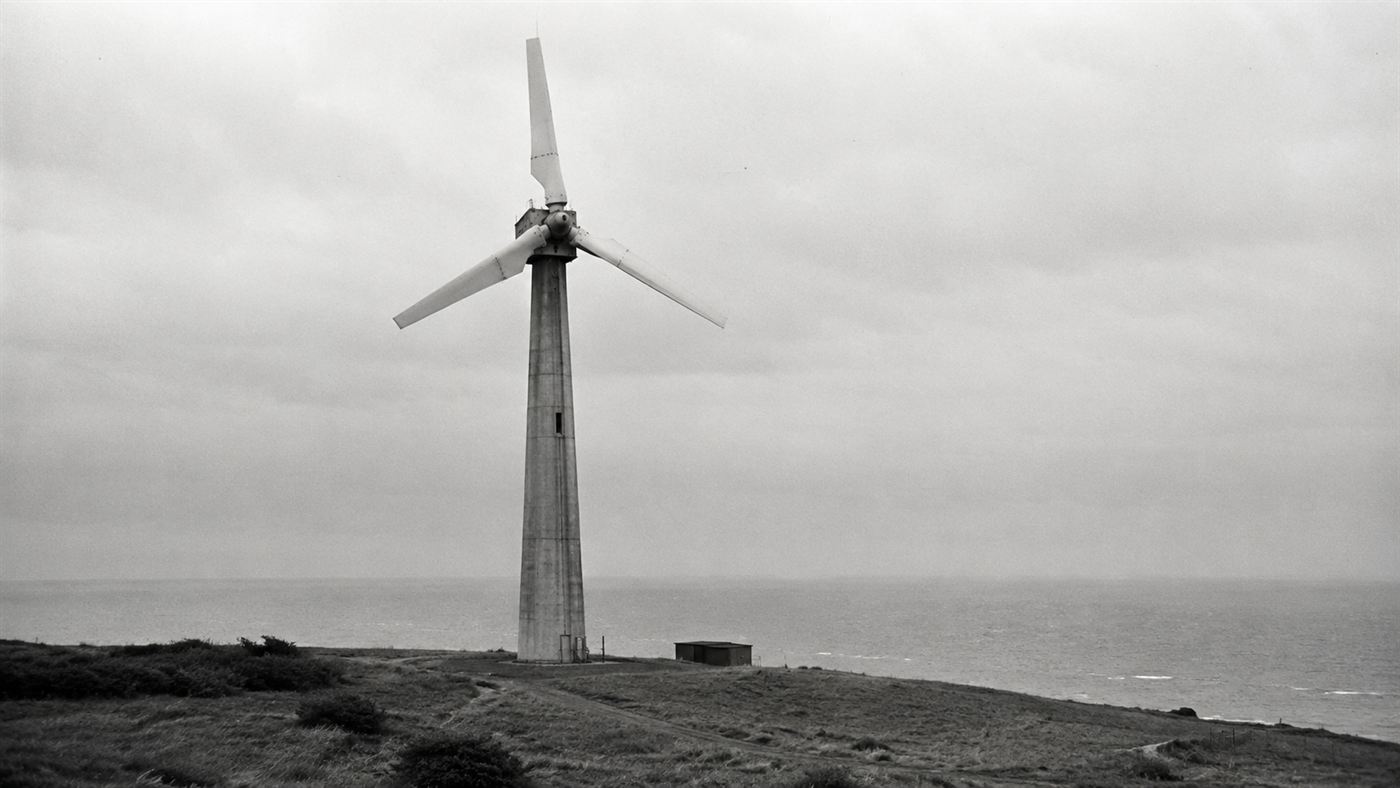 The three-bladed Gedser wind turbine on its concrete tower on the Danish coast in the late 1950s