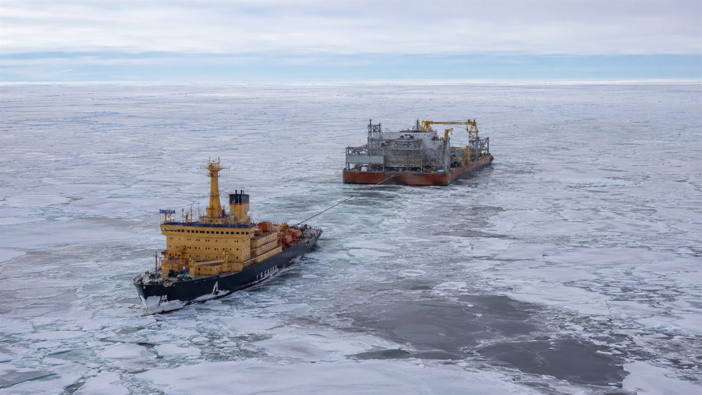An icebreaker towing the floating nuclear power plant barge through Arctic sea ice on its journey to Pevek