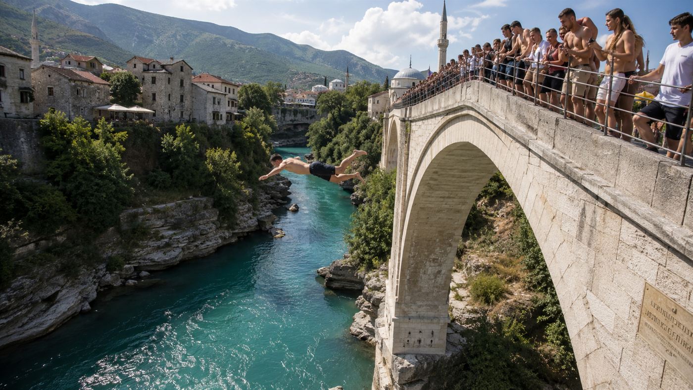 One of Mostar's divers leaping from the bridge into the Neretva river far below