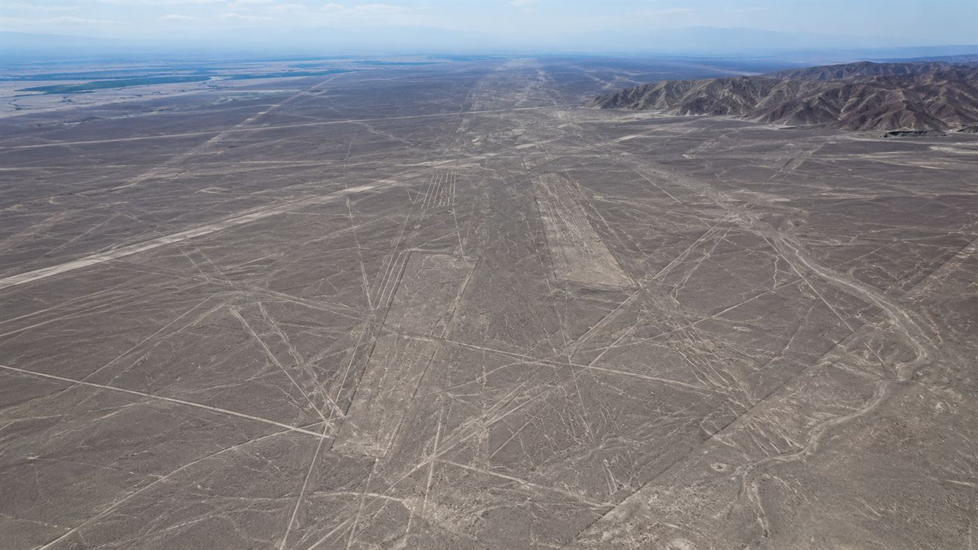 An aerial overview of straight lines and trapezoids across the Nazca desert plateau