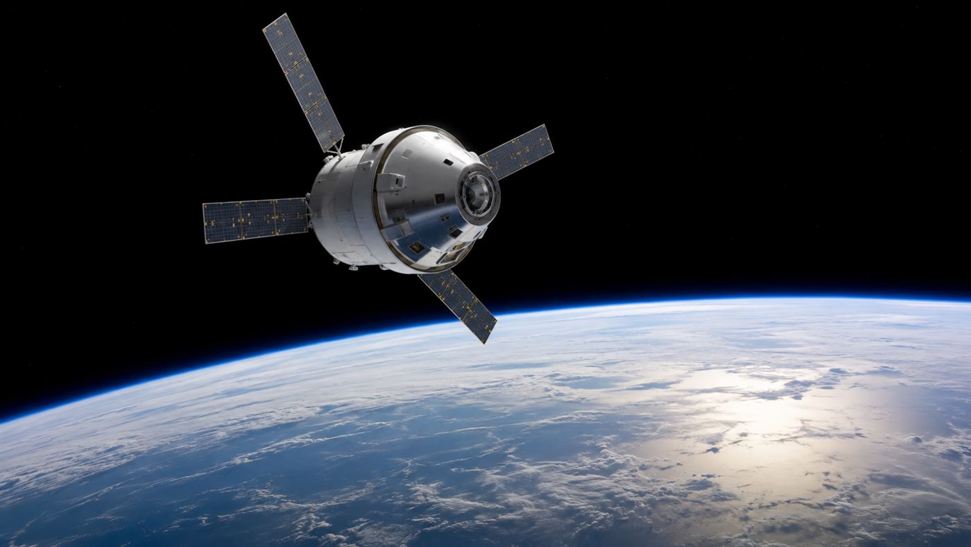 The Orion spacecraft in low Earth orbit with the blue curve of the planet below