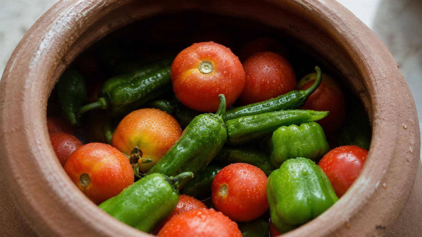 Fresh tomatoes and peppers kept cool inside the pot by evaporative cooling