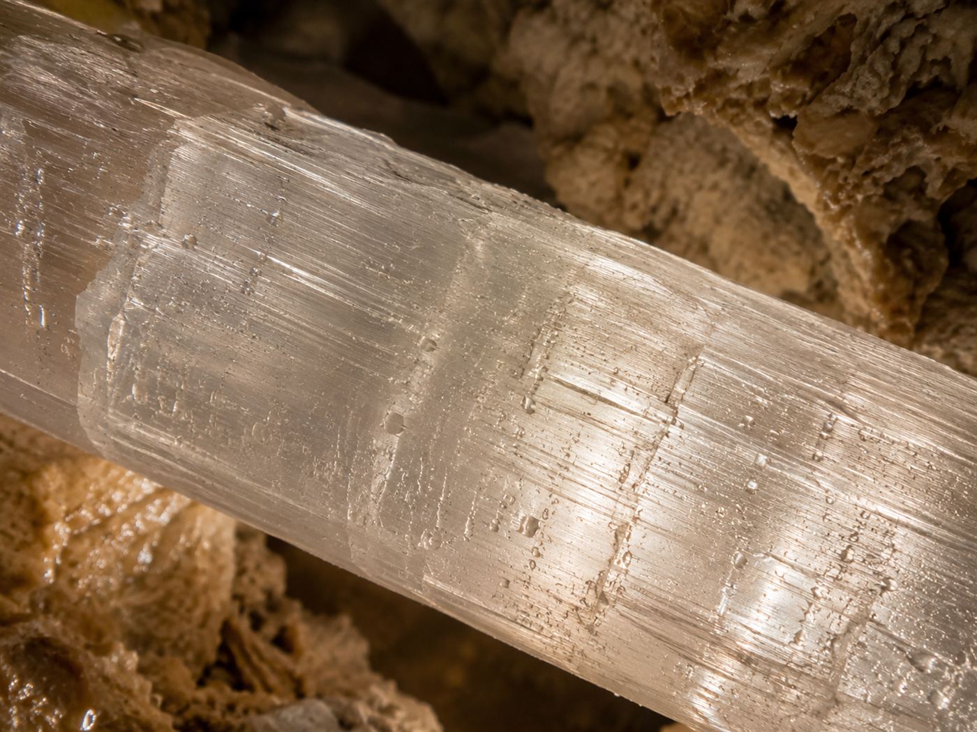 A close view of a massive translucent selenite gypsum crystal beam from the Naica crystal cave