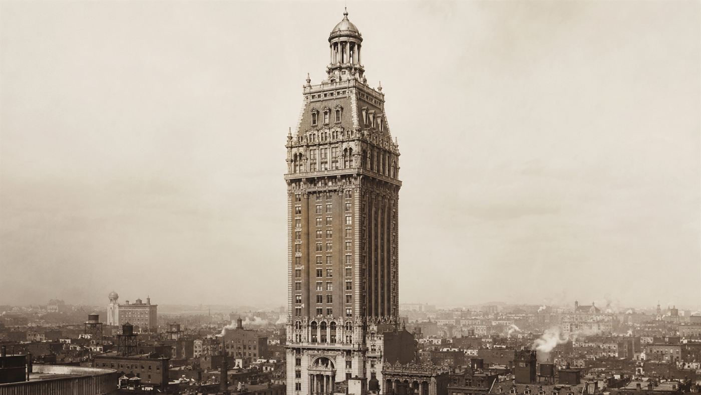 The tall slender Beaux-Arts Singer Building with its domed crown rising above the rooftops of 1908 New York