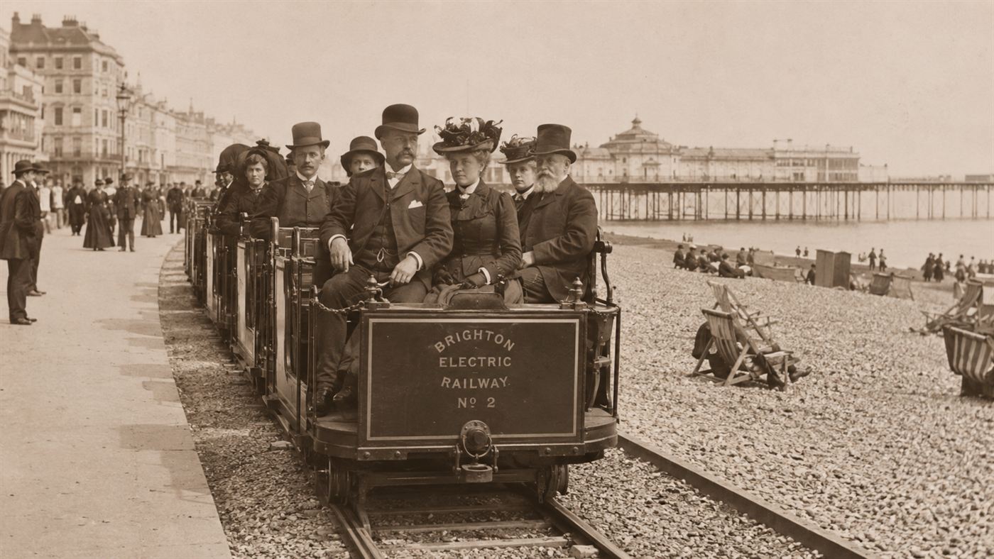 A small Victorian electric railway car running along the Brighton seafront, Volk's Electric Railway