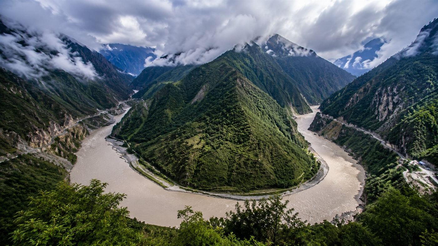The dramatic horseshoe bend of the Yarlung Tsangpo river cutting through steep Himalayan mountains
